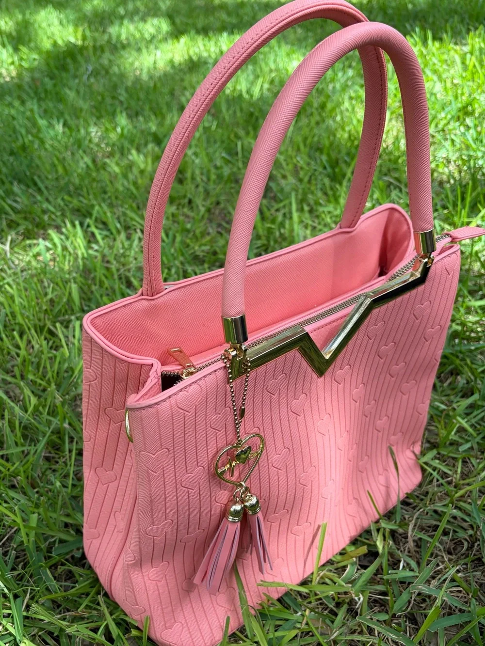 Crossi Pink Structured Heart-Embossed Tote Bag with Tassel Charm
